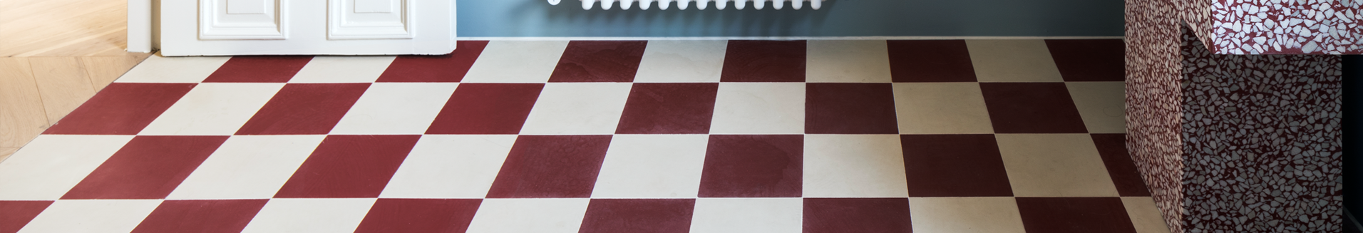 1-red and white grid floor of a bathroom